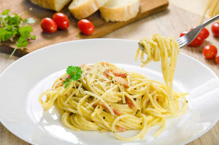 Pasta Carbonara with bacon on a white plate, close-upの写真素材