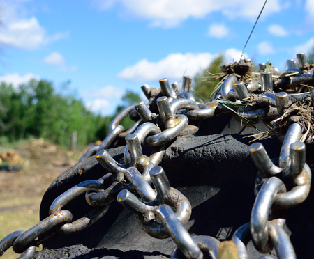 Skidder Tire and Chains on Landing