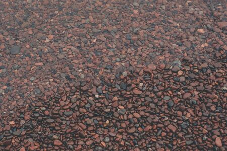 Gentle Wave Over Beach Pebblesの写真素材