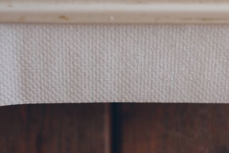 Paper Towel Against Wood Wallの写真素材