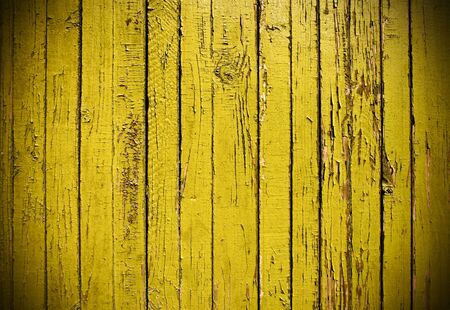 Grunge background from weathered yellow wooden plank
の写真素材