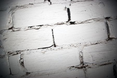 Urban decay scene. Brick wall painted by a white paintの写真素材