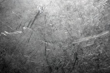 Industrial background from worn brushed metal sheet