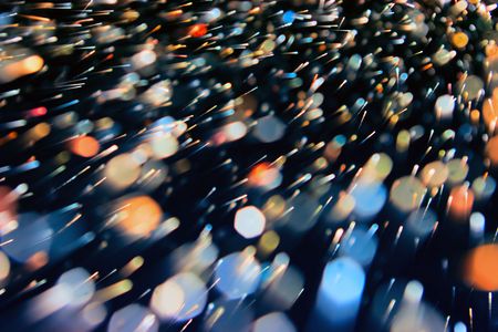 Abstract dynamic background from defocus light tinselの写真素材