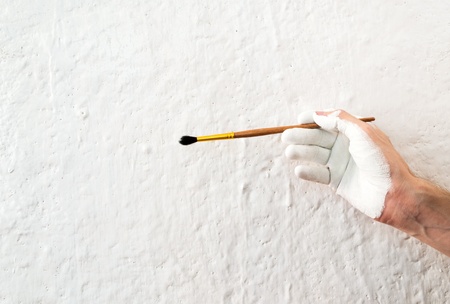 Painting the walls with white paintの写真素材