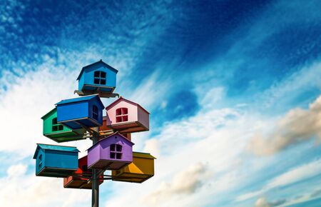 Colorful nesting boxes on blue skyの写真素材