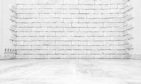 Vintage interior of white brick wall and old wooden floorの写真素材