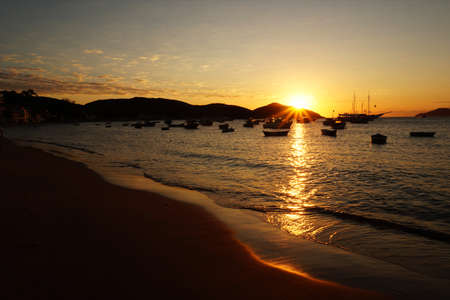 sunset on a summer afternoon in one of many beaches of Buzios, Rio de Janeiro, Brasilの写真素材