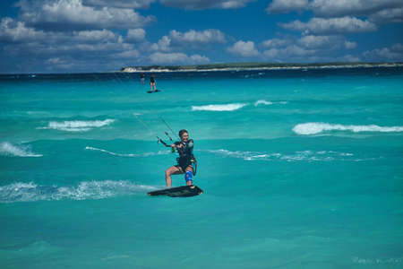 A young woman practicing kitesurf in  a Cayo Guillermo beach, Cubaのeditorial素材