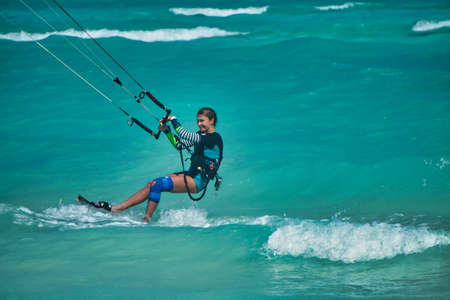 A young woman practicing kitesurf in  a Cayo Guillermo beach, Cubaのeditorial素材