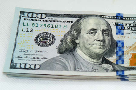 Close up view of a bunch of 100 dollar bills.