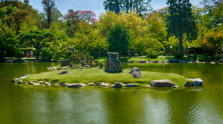 People enjoying a sunny summer morning at "jardin japones" green park, Buenos Aires, Argentinaのeditorial素材