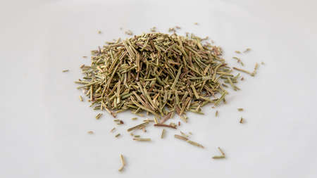 Close view of a bunch of dried rosemary over a white surfaceの写真素材