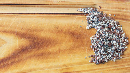 Close view of chia, flax and sesame seeds mix over a white background with copy spaceの写真素材