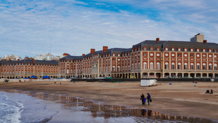 People enjoying a cold winter afternoon at the beach in Mar del Plataのeditorial素材