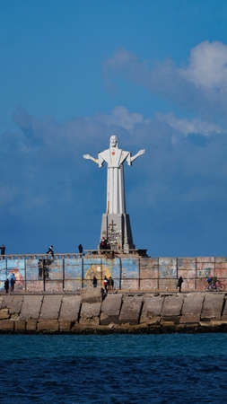 Large San Salvador white statue at the end of Mar del plata fishing portのeditorial素材