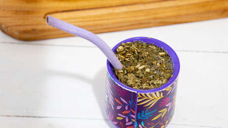 close view of a yerba mate infusion on top of a white tableの写真素材