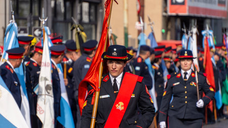Close view of a fire woman marching in a volunteer firefighters day parade.のeditorial素材