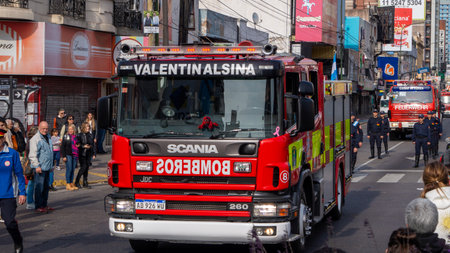Large red firetrucks in a volunteer firemen's day paradeのeditorial素材