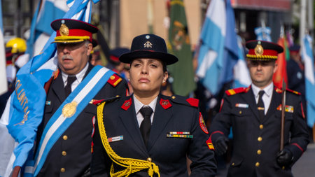 Close view of a fire woman marching in a volunteer firefighters day parade.のeditorial素材