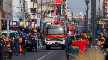 Large red firetrucks in a volunteer firemen's day paradeのeditorial素材