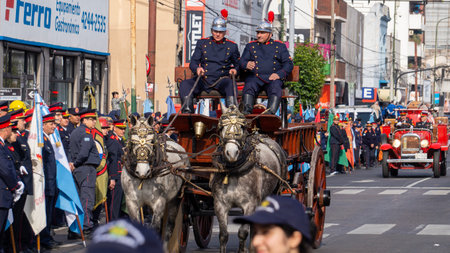 Old horse firefighters carriage and some vintage trucks in volunteer firemen's day paradeのeditorial素材