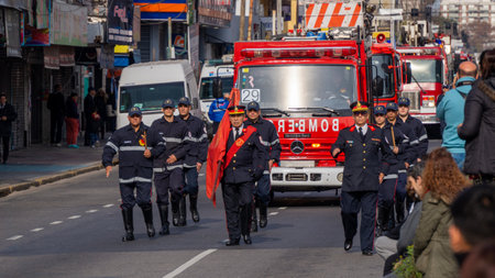 Firefighters marching at volunteer firefighters day paradeのeditorial素材