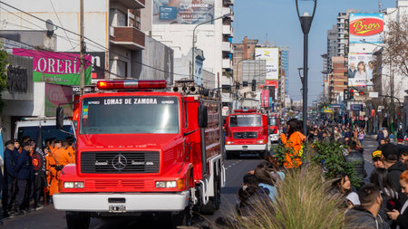 Large red firetrucks in a volunteer firemen's day paradeのeditorial素材