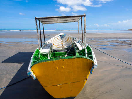 Colorful wooden boat on the beachの写真素材