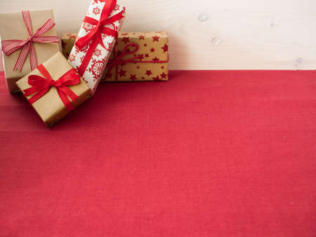 Brown Christmas presents on red tablecloth
