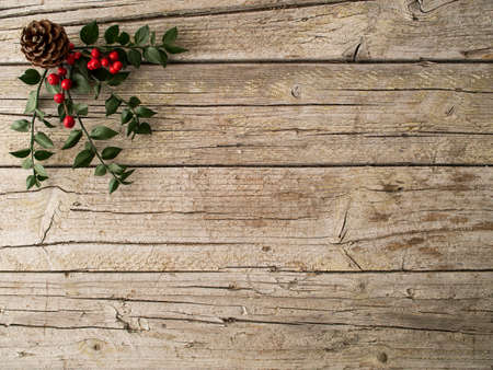 Christmas ornament and pine on wooden backgroundの写真素材