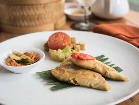 typical Indonesian food served with vegetables