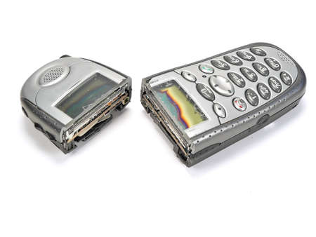 A cell phone sawn in half and disconnectedの写真素材