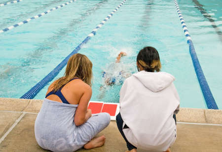 A high school swim meet for competitve athletes and spectatorsの写真素材