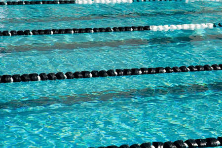 The water texture patterns of a competitive swimming pool after a raceの写真素材