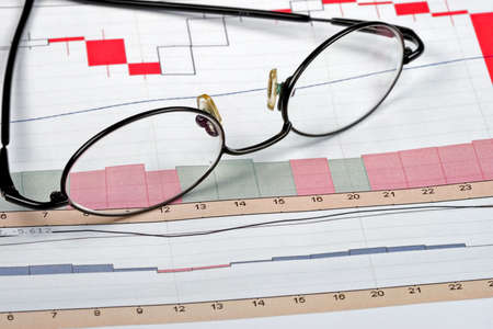 The financial charts of a successful businessman and his company's growthの写真素材