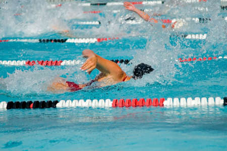 The swimmers compete hard in the high school league championships The swimmers compete hard in the high school league championships