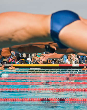 The swimmers compete hard in the high school league championshipsの写真素材