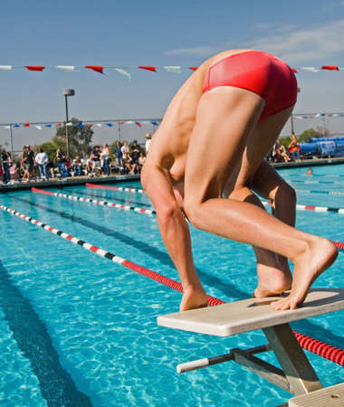 The swimmers compete hard in the high school league championshipsの写真素材