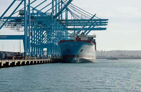 The containers and cargo of world trade move through a busy portの写真素材