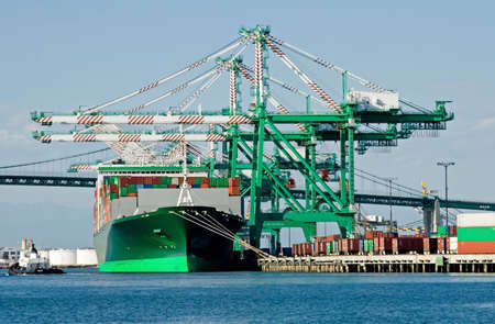 The containers and cargo of world trade move through a busy port
