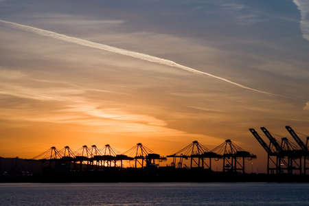 The containers and cargo of world trade move through a busy portの写真素材