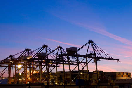 The containers and cargo of world trade move through a busy portの写真素材