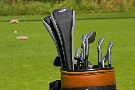 Golf course action and players hitting the greensの写真素材