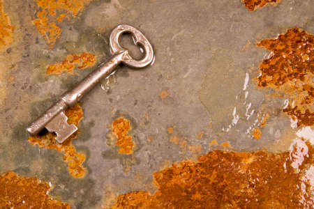 Old skeleton type keys on a solid slate stone foundationの写真素材