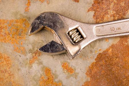 Crescent wrench on a piece of texture stone slateの写真素材