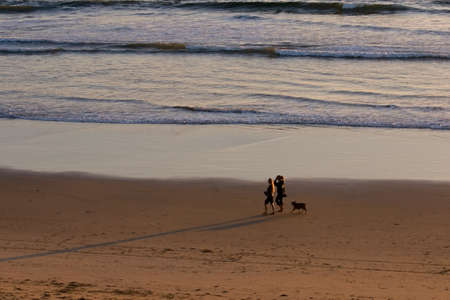 Sun set reflections on the ocean at the beachの写真素材