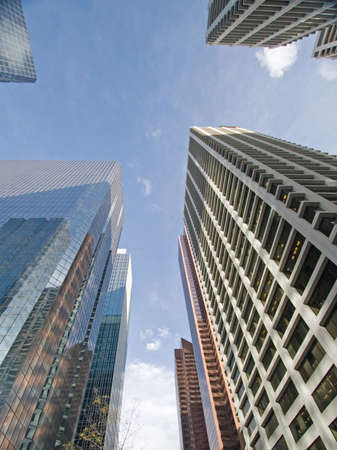 Downtown Calgary office buildings soaring into the skyline while gleaming in the sunの写真素材