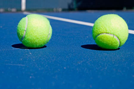 Resort tennis club and tennis courts with ballsの写真素材