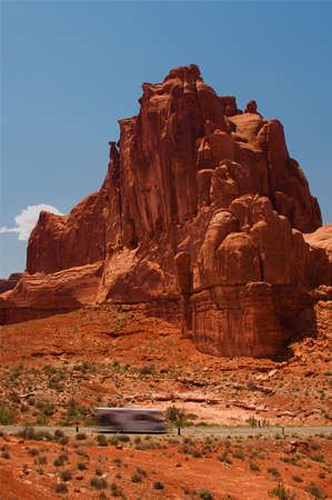 Summer vacation travelers tour through Arches National Park in Utah USA